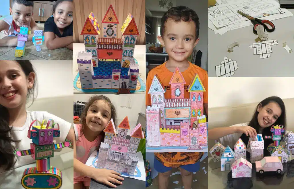 Crianças mostrando o castelo, o robô e a casinha que montaram com as atividades